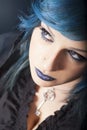 Dark woman with blue hair and lipstick. Key pendant. Dark girl Royalty Free Stock Photo