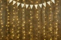 Dark wood background with lights and flags, abstract holiday backdrop, copy space for text Royalty Free Stock Photo