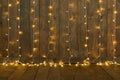 Dark wood background with lights, wall and floor, abstract holiday backdrop, copy space for text