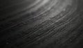 Dark wood grain texture with rough lines and ridges. Natural black background with subtle light and shadow effects. Ideal for Royalty Free Stock Photo