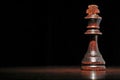 Dark wood king chess piece