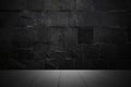 Dark wood table and black concrete wall background. To display montages Product