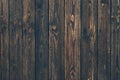 Dark wood vertical planks. Wooden rustic pattern of timber floor. Dirty wall, brown pine texture. Abstract natural background. Royalty Free Stock Photo