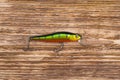 On a dark wooden background, bait with a hook, for catching fish Royalty Free Stock Photo