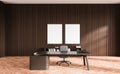 Dark wooden CEO office with posters Royalty Free Stock Photo