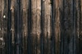 Dark wooden fence with hobnails. Vintage rustic pattern with brown old wood texture background. Oak texture, parquet. Dark brown p