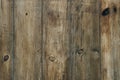 Dark wooden fence. Shabby table, dirty pine lumber. Old wood boards Royalty Free Stock Photo