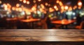 Dark wooden table with abstract restaurant background, ideal for product displays