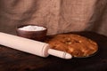 On a dark wooden table american apricot pie, ingredients and tools on black background Royalty Free Stock Photo