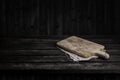 Dark wooden table for product, old black wooden perspective interior with old cutting board Royalty Free Stock Photo