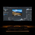 Dark Workspace with illuminated Keyboard Displaying Landscape Editing Software Application, generative ai Royalty Free Stock Photo