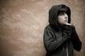 Dark young woman sad standing near urban wall portrait