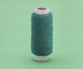 darkCyan color yarn or spool thread over on background