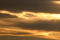 Darker clouds with golden linings at sunset Royalty Free Stock Photo