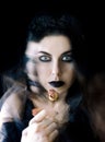 Darkhair gothic girl with black lips Royalty Free Stock Photo