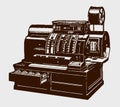 Darkish, antique cash register with open drawer in three-quarter front view