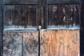 Darkly ragged wooden vintage door with keyhole