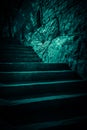 Darkness and horror, ghost house. Dark stone ruined old staircase from the basement with mystical shadows and strange light Royalty Free Stock Photo