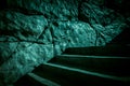 Darkness and horror, ghost house. Dark stone ruined old staircase from the basement with mystical shadows and strange light Royalty Free Stock Photo