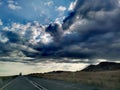 Darkness of rain clouds and road