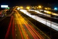 Darknight traffic light trails on street. Royalty Free Stock Photo