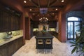 Darkwood And Beamed Ceiling In Spacious Kitchen