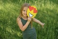 Darling girl holds a paper face of a loving smile with hearts instead of eyes Royalty Free Stock Photo