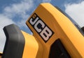 Close up of JCB digger showing bodywork and company logo branding Royalty Free Stock Photo