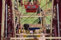 People in seats on ferris wheel fun fair carnival ride Royalty Free Stock Photo