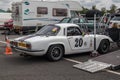 White classic vintage racing car in paddock