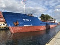 Darlowko, Poland: Cargo ship leaving the port on a summer day Royalty Free Stock Photo