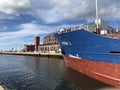 Darlowko, Poland: Cargo ship leaving the port on a summer day