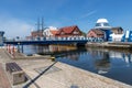 Darlowo, zachodni-pomorskie / Poland - June, 4, 2020: Bridge across the river in the port city. Buildings in the port of Central Royalty Free Stock Photo