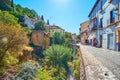 The Darro River and ruins of Puente del Cadi bridge, Albaicin, Granada, Spain