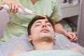 Darsonval face therapy. Royalty Free Stock Photo