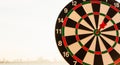 Dart arrow hit center on bullseye dartboard is target