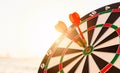 Dart arrow hit center on bullseye dartboard is target