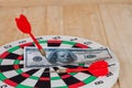 Dart arrow hitting in bullseye on dartboard Royalty Free Stock Photo