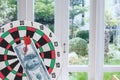 Dart arrow hitting in bullseye on dartboard with money Royalty Free Stock Photo