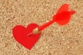 Dart arrow hitting in a red heart on pinboard - Concept of love Royalty Free Stock Photo