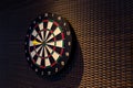 Dart arrow hitting in the target center of dartboard. Darts board.Success hitting target aim goal achievement concept background Royalty Free Stock Photo