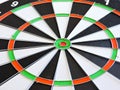 Dart arrow hitting in the target center of dartboard. Success hitting target aim goal achievement concept background.Darts and dar Royalty Free Stock Photo