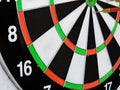 Dart arrow hitting in the target center of dartboard. Success hitting target aim goal achievement concept background.Darts and dar Royalty Free Stock Photo