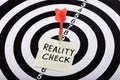 Dart And Arrow With Reality Check Word On Sticky Note Royalty Free Stock Photo