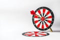 Dart Board with Arrow Targeting Center Goal on White Background for Business Concept Visualization Royalty Free Stock Photo