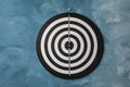 Dart board hanging on textured wall Royalty Free Stock Photo