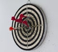 Dart board with hanging on the wall Royalty Free Stock Photo