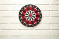 Dart Board on the white wall background Royalty Free Stock Photo