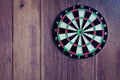 Dart board on wooden old wall High Dynamic Range tone.