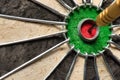 A dart hits the center of the darts board also known as